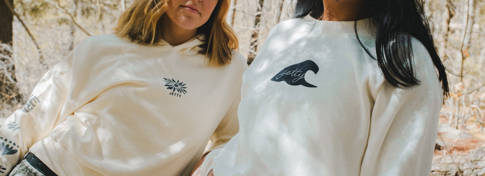 Two women wearing Jetty Hoodies